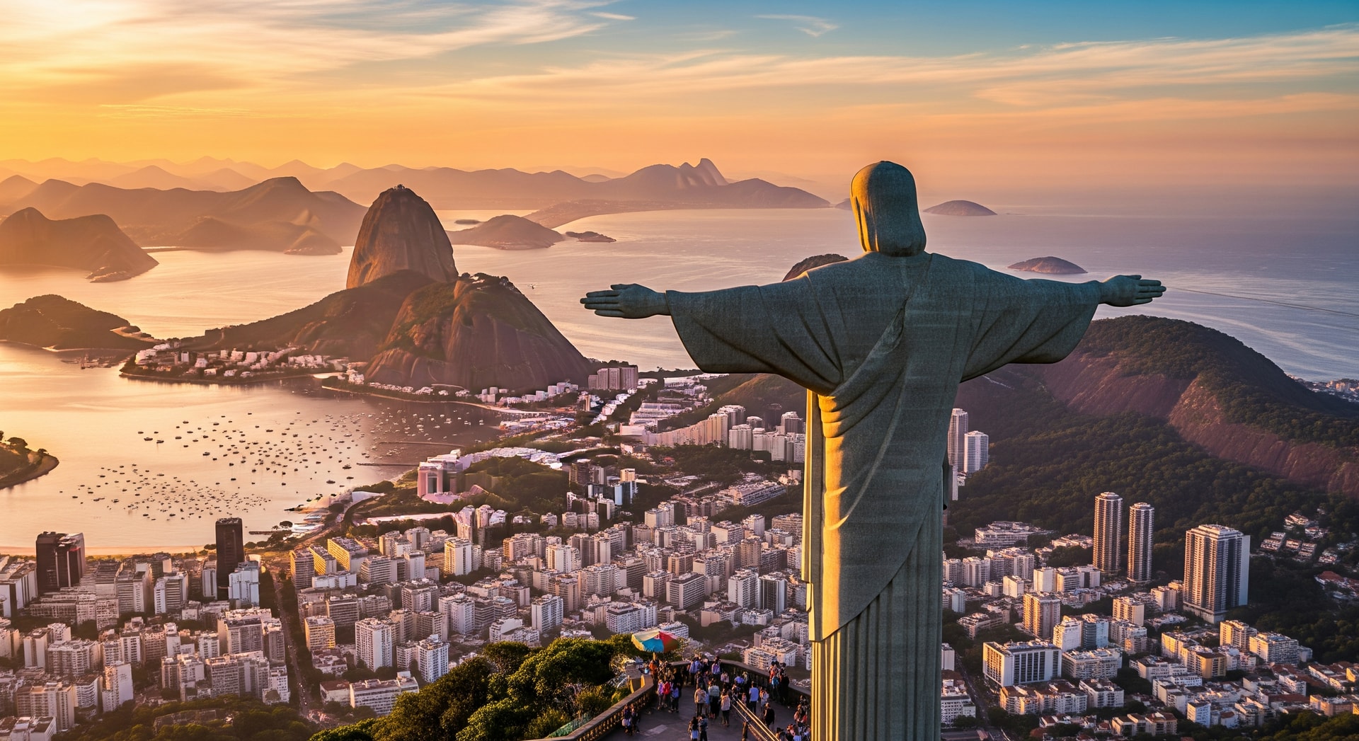 Christ the Redeemer statue overlooking Rio de Janeiro with Sugarloaf Mountain