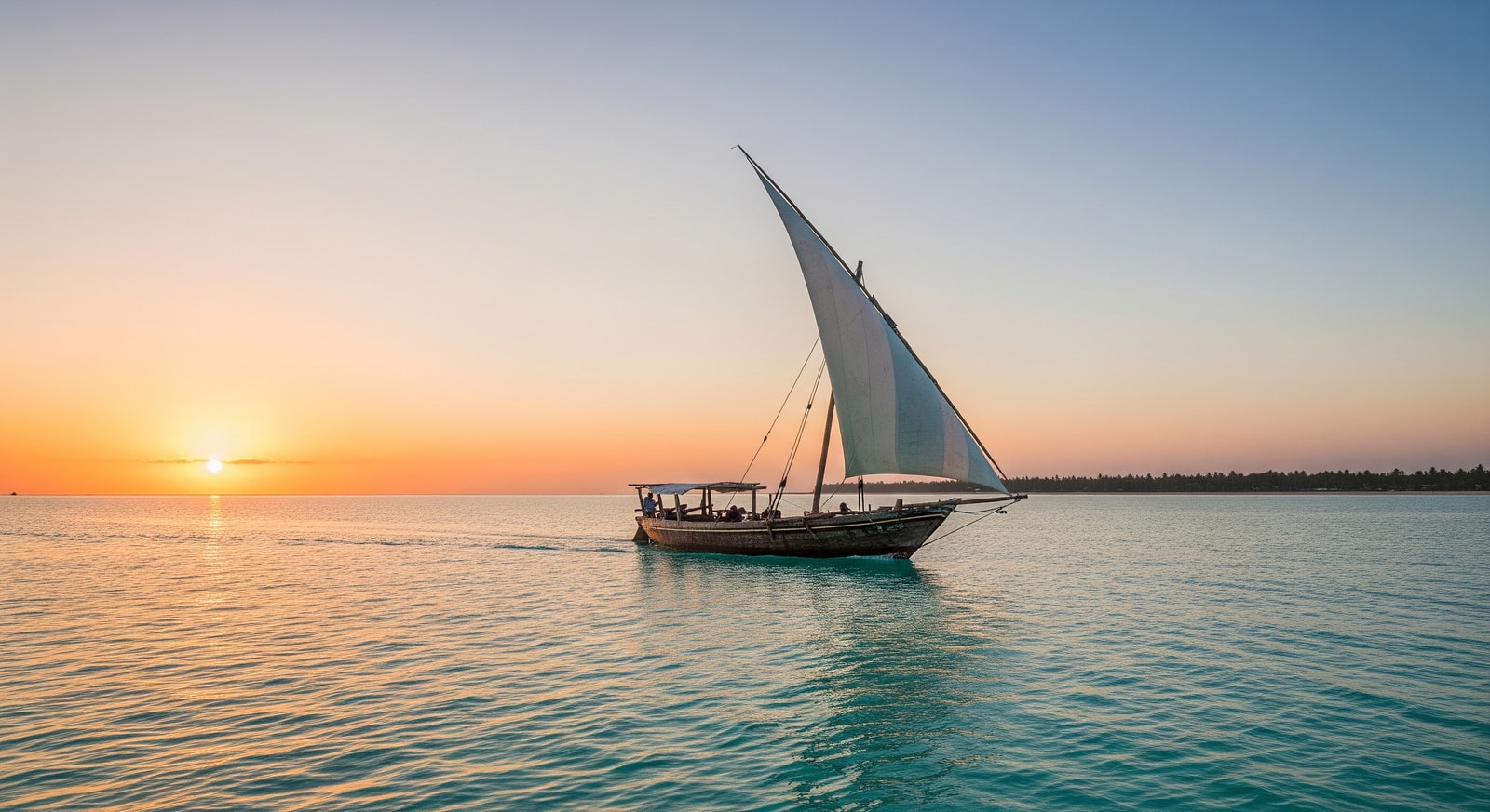 Traditional dhow sailing boat on crystal clear waters of the Kenyan coast at sunset