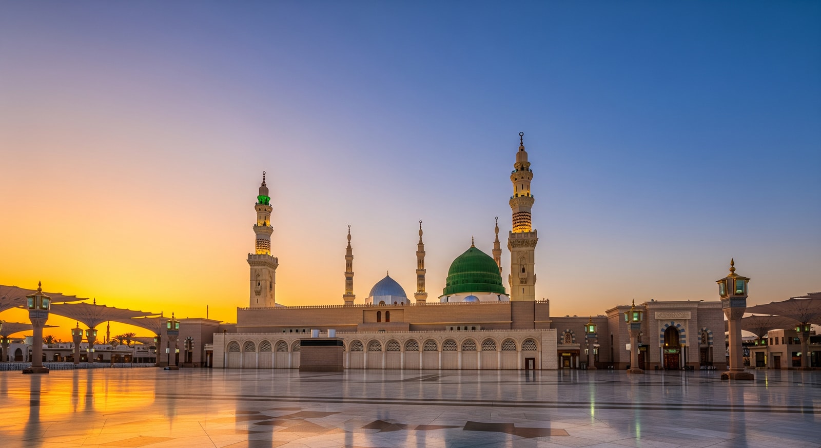 Prophet's Mosque Al-Masjid an-Nabawi in Madinah with green dome at sunset