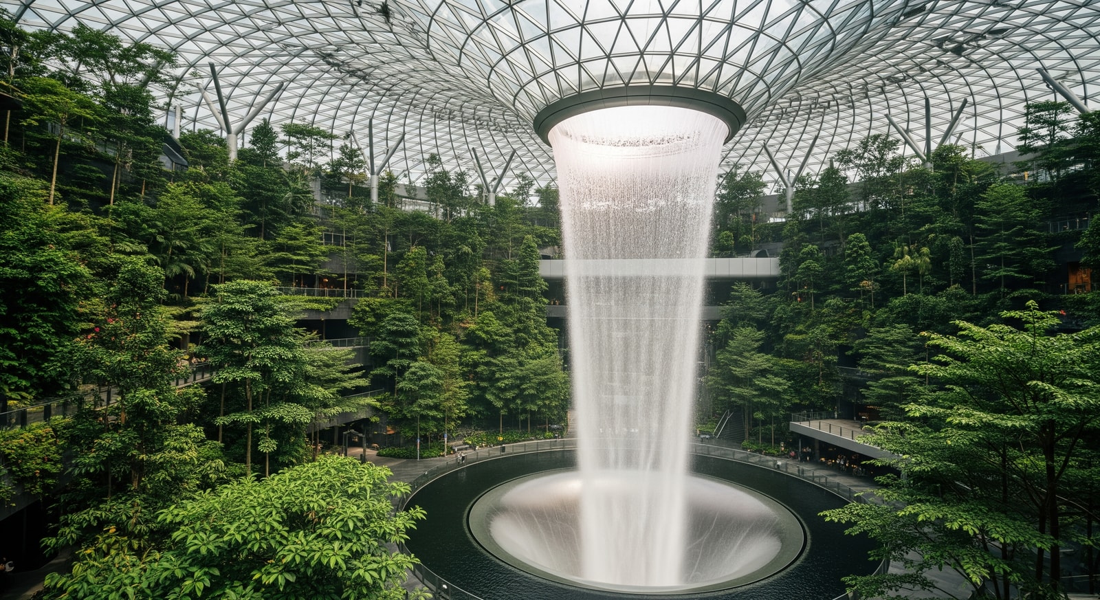 Jewel Changi Airport rain vortex indoor waterfall surrounded by plants