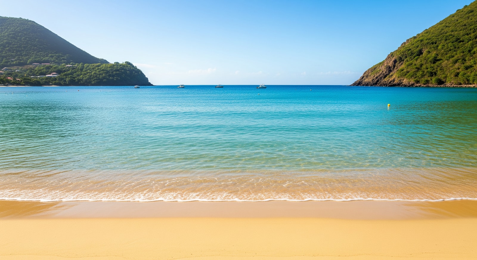 South Friars Beach in St Kitts with golden sand and calm turquoise water