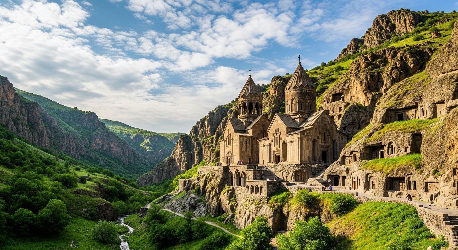 Geghard Monastery carved into the rocky mountainside with medieval Armenian architecture and natural caves
