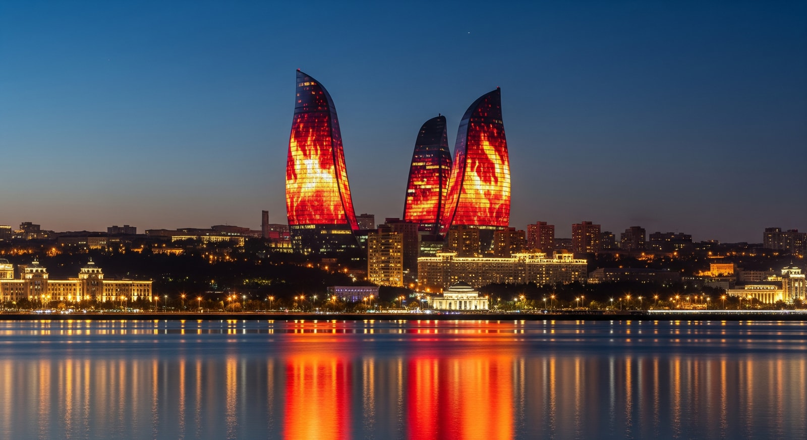 Iconic Flame Towers of Baku illuminated at night with LED displays reflecting Azerbaijan's identity as Land of Fire