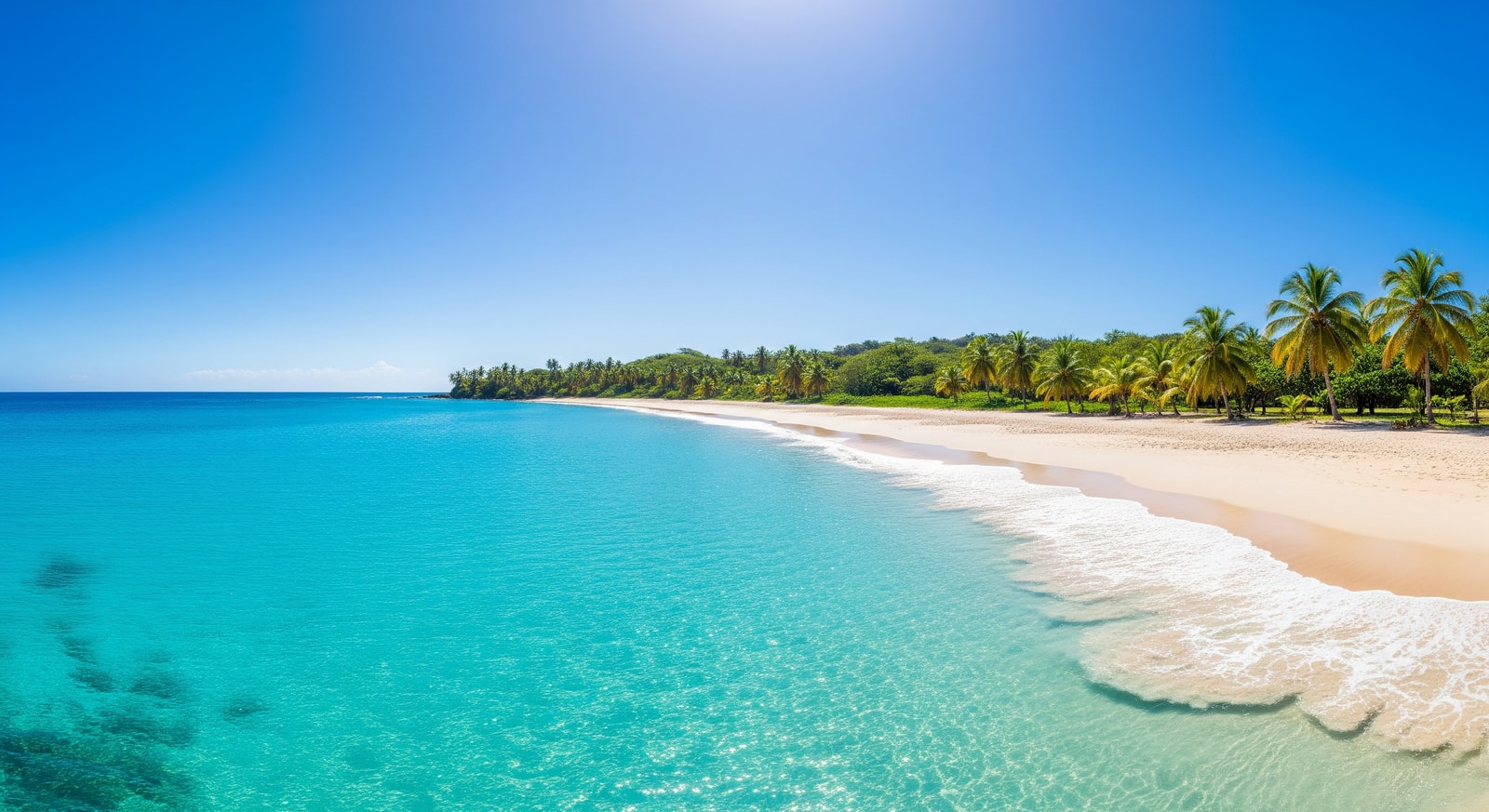 Crystal clear turquoise waters and white sand at Grand Anse Beach in Grenada