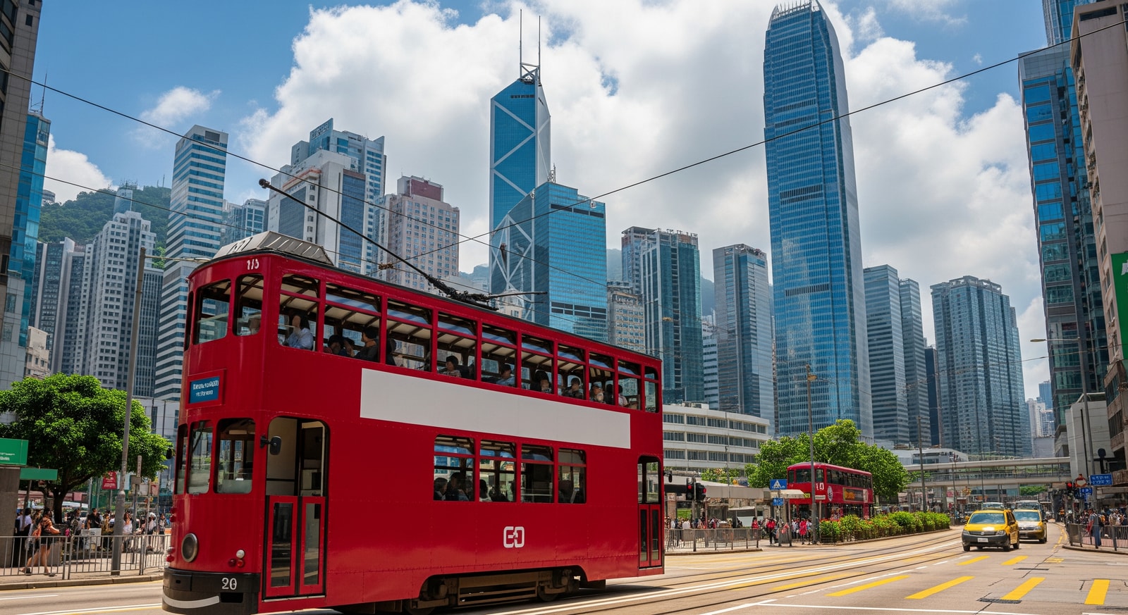 Historic double-decker tram traveling through Central district with modern skyscrapers behind